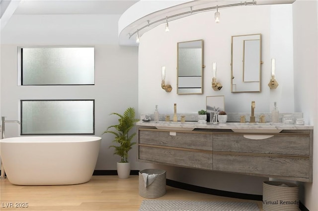 60 Innisbrook Ave, Las Vegas, NV 89113 - full bathroom featuring double vanity, wood finished floors, and a soaking tub