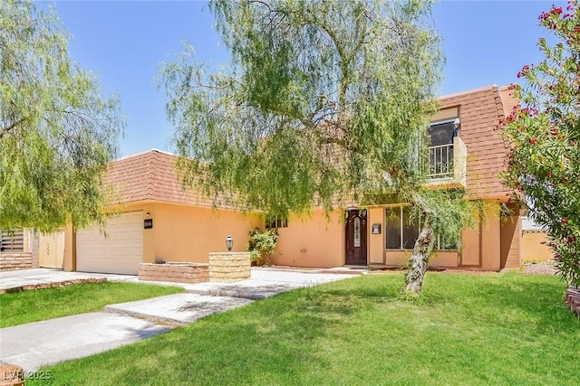 2614 Capistrano Ave, Las Vegas, NV 89121 - front facade with stucco siding, a front lawn, mansard roof, driveway, and a garage
