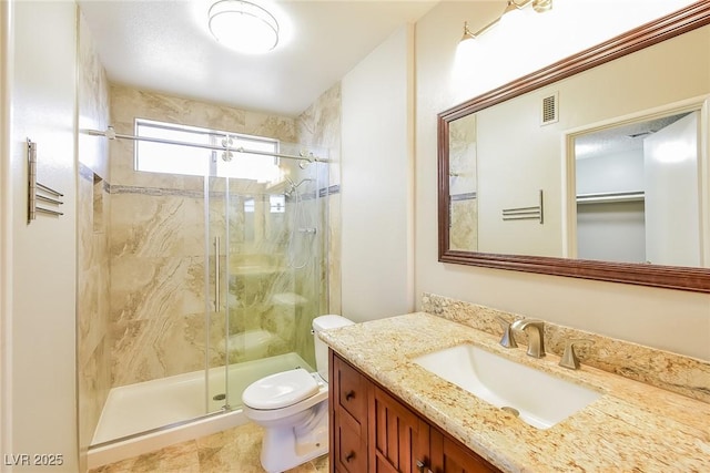 2614 Capistrano Ave, Las Vegas, NV 89121 - bathroom featuring a shower stall, vanity, and toilet