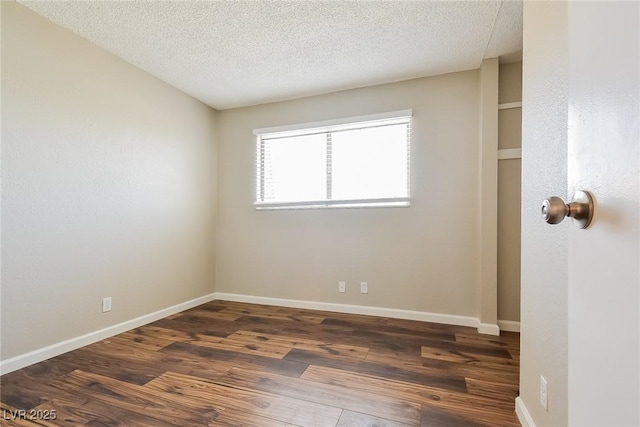 2614 Capistrano Ave, Las Vegas, NV 89121 - unfurnished room featuring wood finished floors, a textured ceiling, and baseboards