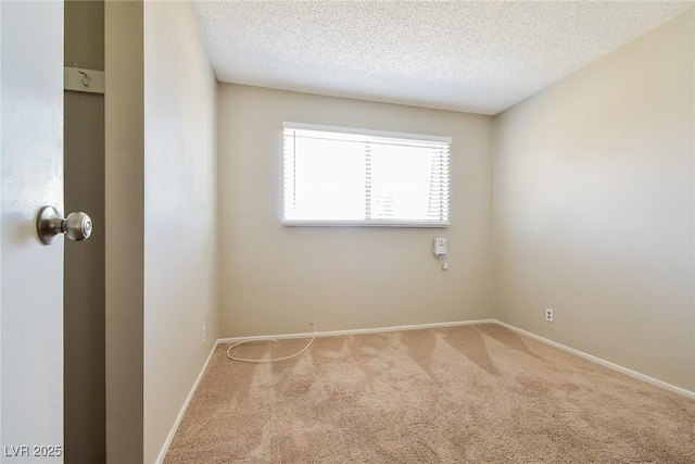 2614 Capistrano Ave, Las Vegas, NV 89121 - unfurnished room featuring carpet floors, baseboards, and a textured ceiling