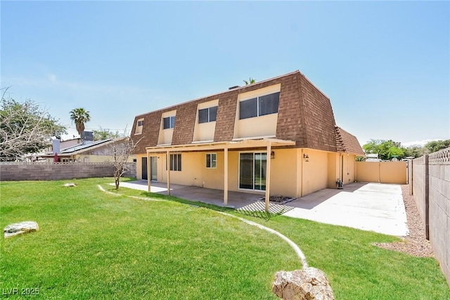 2614 Capistrano Ave, Las Vegas, NV 89121 - rear view of house with a patio, stucco siding, mansard roof, and roof with shingles