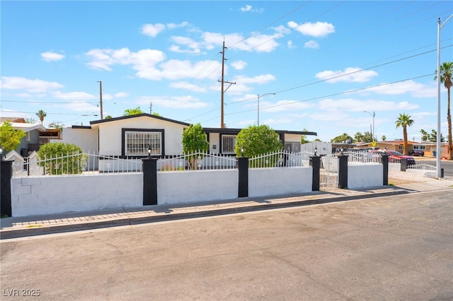 517 N 22nd St, Las Vegas, NV 89101 - view of front of property featuring a fenced front yard and stucco siding