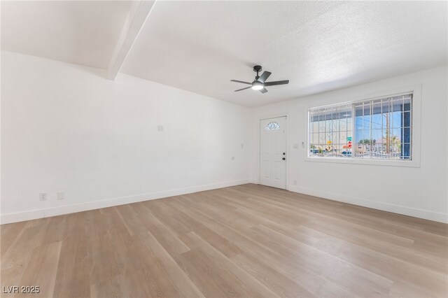 517 N 22nd St, Las Vegas, NV 89101 - empty room with ceiling fan, light wood-style floors, and baseboards