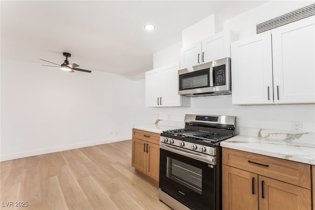 517 N 22nd St, Las Vegas, NV 89101 - kitchen featuring stainless steel appliances, light wood-type flooring, ceiling fan, recessed lighting, and baseboards
