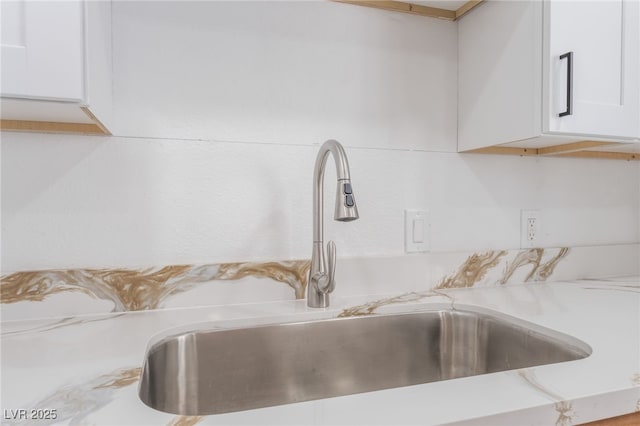 517 N 22nd St, Las Vegas, NV 89101 - kitchen view of a sink, light countertops, and white cabinets