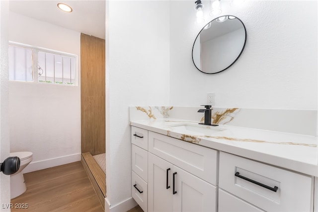 517 N 22nd St, Las Vegas, NV 89101 - full bath featuring toilet, vanity, wood finished floors, walk in shower, and baseboards