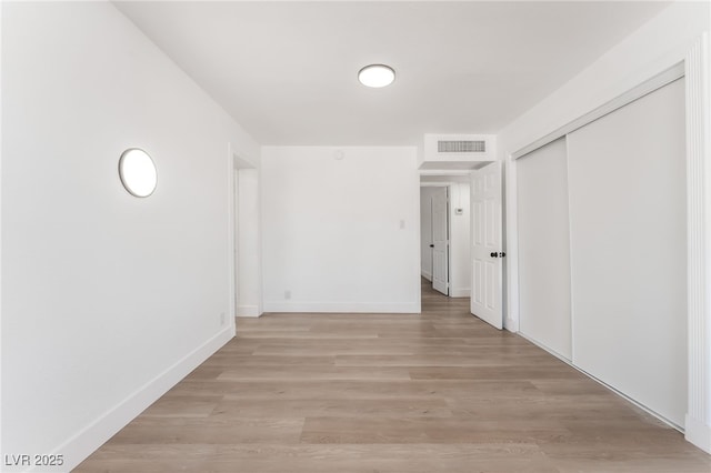 517 N 22nd St, Las Vegas, NV 89101 - unfurnished bedroom featuring a closet, light wood-style flooring, and baseboards