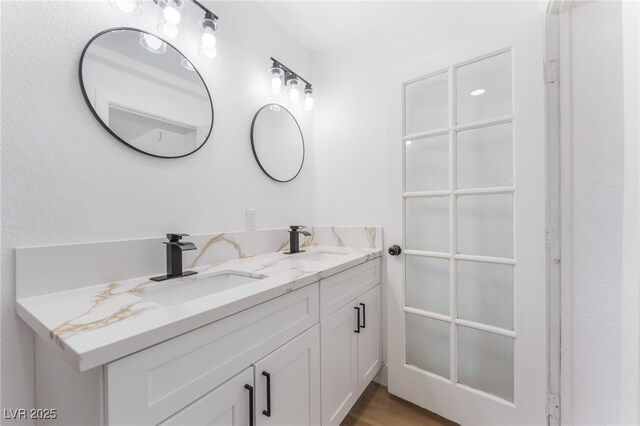 517 N 22nd St, Las Vegas, NV 89101 - full bathroom with double vanity and wood finished floors