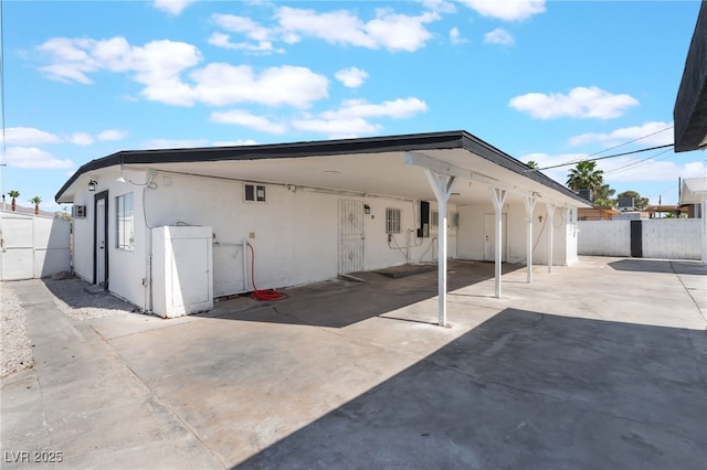 517 N 22nd St, Las Vegas, NV 89101 - rear view of house with stucco siding and a carport
