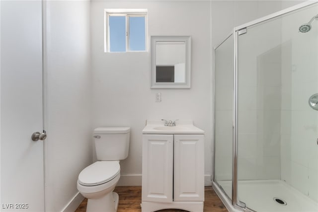 517 N 22nd St, Las Vegas, NV 89101 - full bathroom with toilet, a stall shower, vanity, and wood finished floors