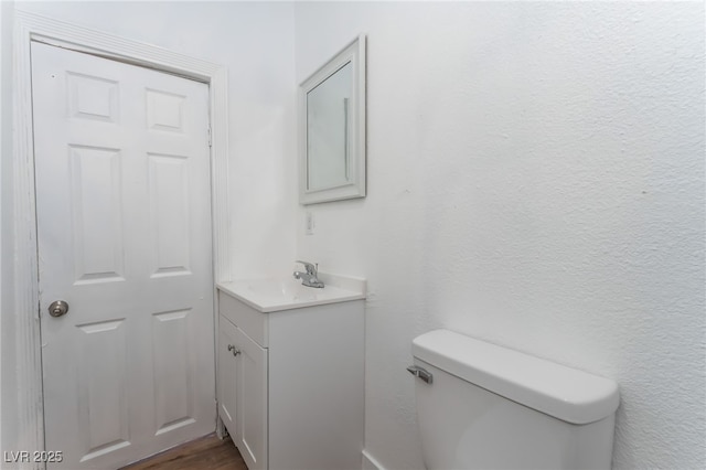 517 N 22nd St, Las Vegas, NV 89101 - bathroom featuring vanity, toilet, and wood finished floors