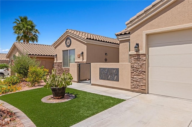1309 Vista Del Monte Dr, Mesquite, NV 89027 - mediterranean / spanish-style home with stucco siding, a tile roof, and stone siding