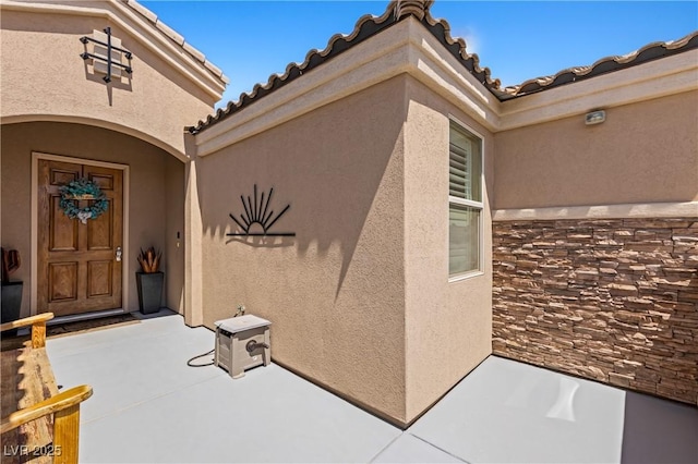 1309 Vista Del Monte Dr, Mesquite, NV 89027 - property entrance featuring stucco siding and a tile roof