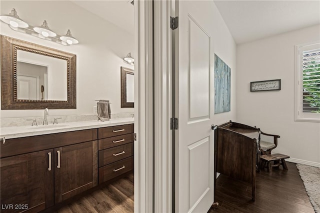 1309 Vista Del Monte Dr, Mesquite, NV 89027 - bathroom featuring wood finished floors, vanity, and baseboards