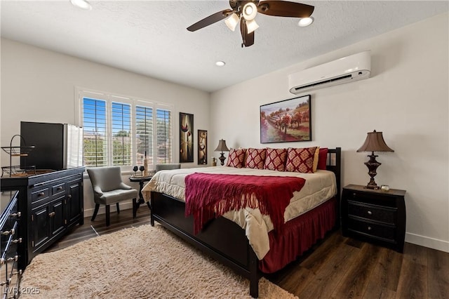 1309 Vista Del Monte Dr, Mesquite, NV 89027 - bedroom with a wall unit AC, dark wood-type flooring, baseboards, recessed lighting, and a ceiling fan