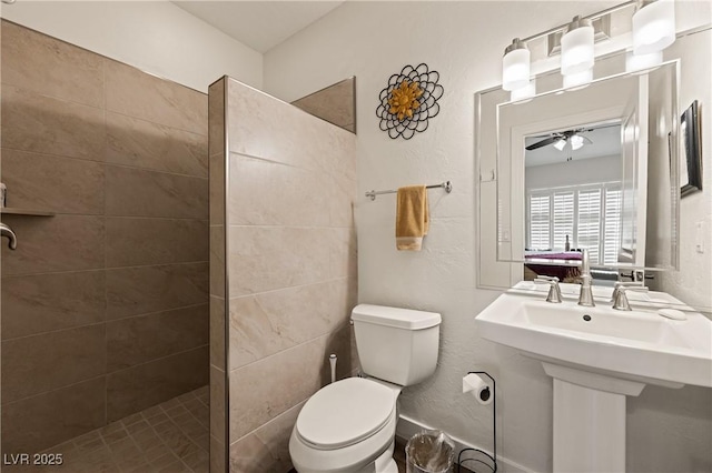 1309 Vista Del Monte Dr, Mesquite, NV 89027 - bathroom featuring a walk in shower, toilet, a ceiling fan, and a sink