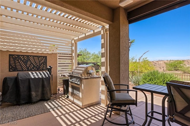 1309 Vista Del Monte Dr, Mesquite, NV 89027 - view of patio / terrace with exterior kitchen and a pergola