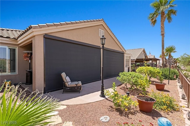 1309 Vista Del Monte Dr, Mesquite, NV 89027 - view of property exterior featuring a patio and stucco siding