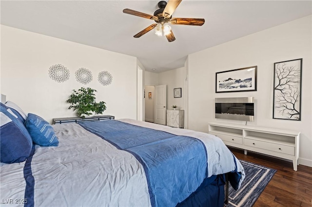 1309 Vista Del Monte Dr, Mesquite, NV 89027 - bedroom featuring wood finished floors, a ceiling fan, and baseboards