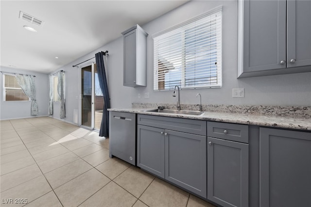 10373 Northern Hills Ave, Las Vegas, NV 89166 - kitchen featuring stainless steel dishwasher, gray cabinets, and light tile patterned floors