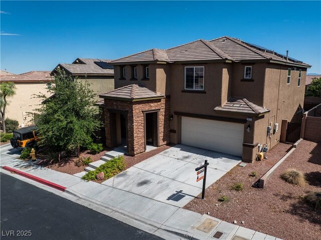 10373 Northern Hills Ave, Las Vegas, NV 89166 - traditional home with stucco siding, a garage, concrete driveway, stone siding, and a tiled roof