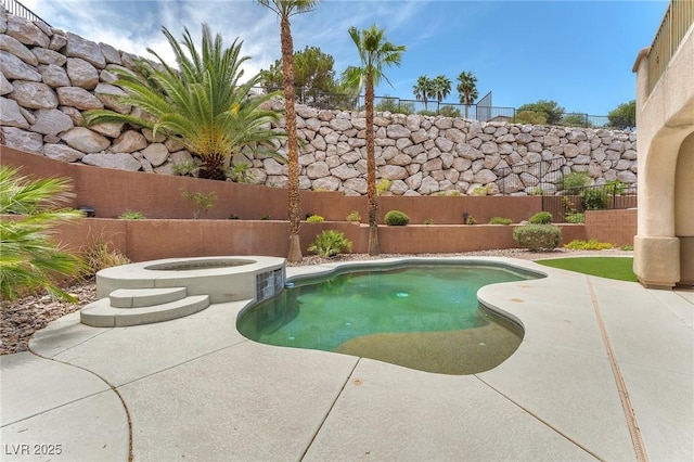 1155 Phillip Island St, Henderson, NV 89052 - view of swimming pool featuring a fenced backyard, a patio area, and an in-ground hot tub