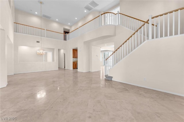 1155 Phillip Island St, Henderson, NV 89052 - unfurnished living room featuring a high ceiling, stairway, a chandelier, and recessed lighting