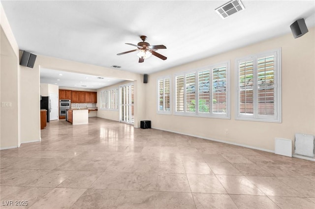 1155 Phillip Island St, Henderson, NV 89052 - unfurnished living room with a ceiling fan, plenty of natural light, light tile patterned floors, and recessed lighting