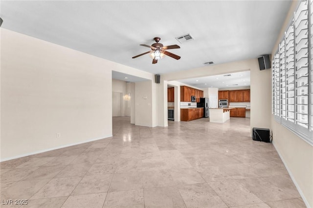 1155 Phillip Island St, Henderson, NV 89052 - unfurnished living room with a ceiling fan and baseboards