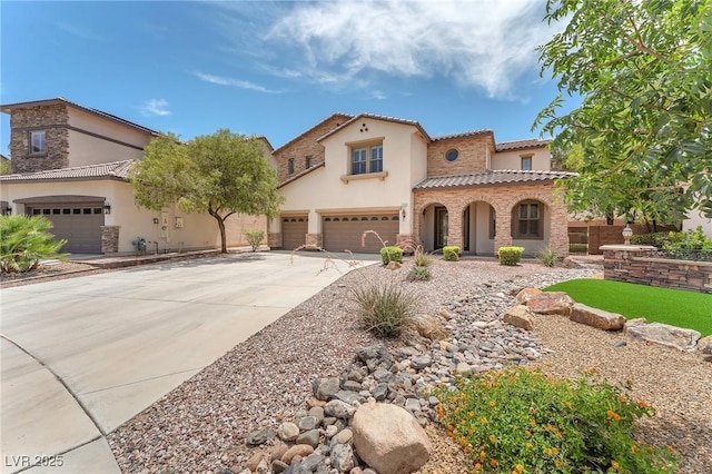 1155 Phillip Island St, Henderson, NV 89052 - mediterranean / spanish house featuring stone siding, stucco siding, driveway, and a garage