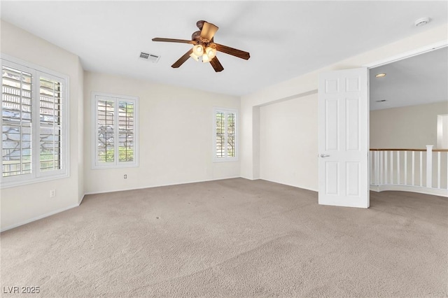 1155 Phillip Island St, Henderson, NV 89052 - unfurnished bedroom with multiple windows, carpet flooring, and ceiling fan