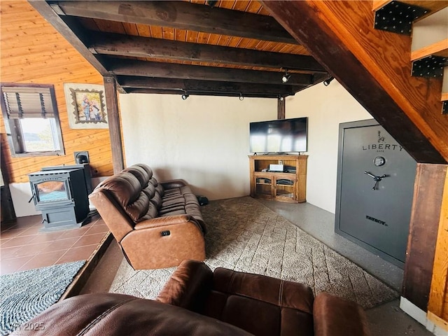 250 E Madison Ave, Ely, NV 89301 - living area with a wood stove, wooden walls, and beamed ceiling
