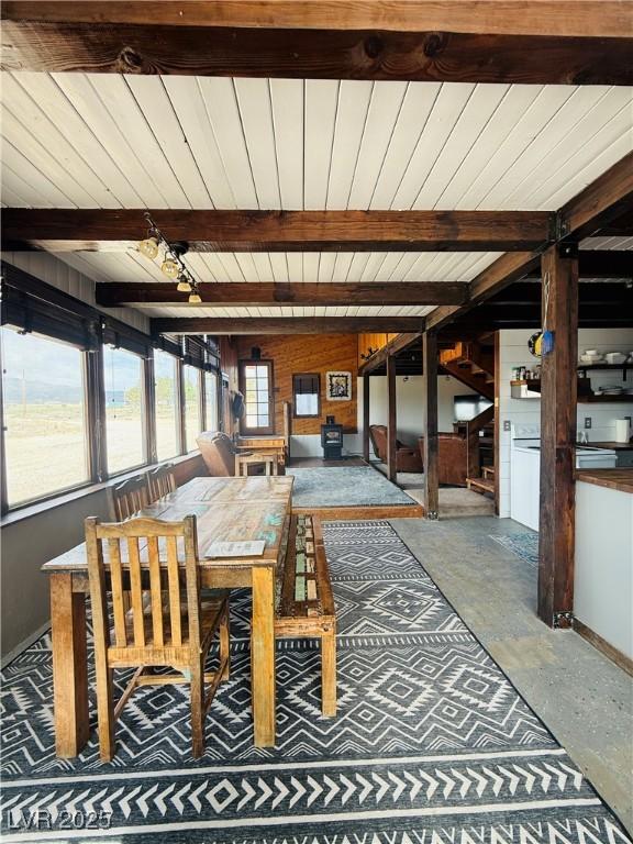 250 E Madison Ave, Ely, NV 89301 - dining space featuring wood ceiling with exposed beams and baseboards