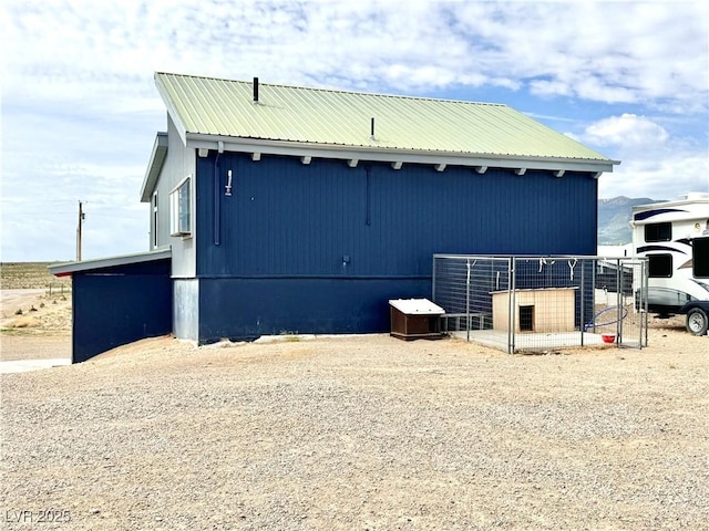 250 E Madison Ave, Ely, NV 89301 - view of side of property with metal roof and an outbuilding
