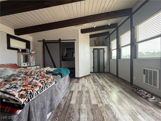 250 E Madison Ave, Ely, NV 89301 - bedroom featuring a barn door, wood finished floors, wood ceiling with exposed beams, and baseboards