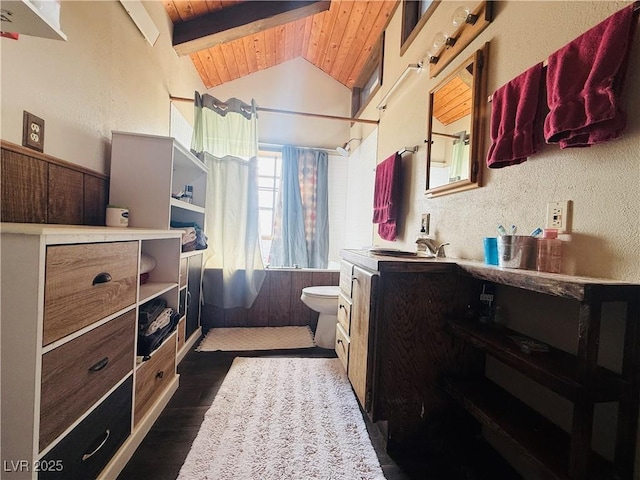 250 E Madison Ave, Ely, NV 89301 - full bathroom with wood ceiling, shower / bath combo, toilet, vanity, and wood finished floors