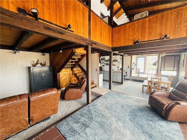 250 E Madison Ave, Ely, NV 89301 - living room with wood ceiling, stairs, wooden walls, track lighting, and light tile patterned floors