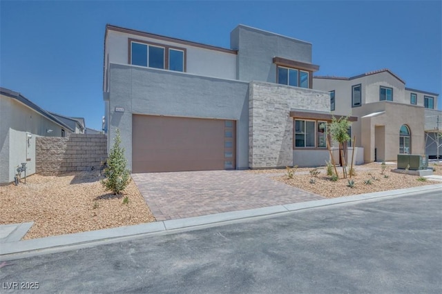 9265 Frazer St, Las Vegas, NV 89166 - view of front of home with driveway, stucco siding, and an attached garage