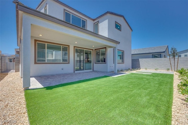 9265 Frazer St, Las Vegas, NV 89166 - rear view of house with stucco siding and a patio area
