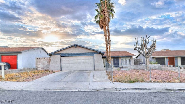4145 Plumtree St, Las Vegas, NV 89115 - ranch-style house featuring an attached garage, driveway, and stucco siding