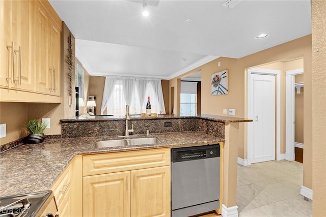 270 E Flamingo Rd Unit 131, Las Vegas, NV 89169 - kitchen with stainless steel dishwasher, a sink, light brown cabinets, dark stone counters, and stove