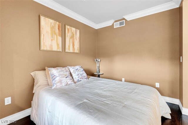 270 E Flamingo Rd Unit 131, Las Vegas, NV 89169 - bedroom featuring crown molding, baseboards, and dark wood-style flooring