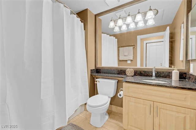 270 E Flamingo Rd Unit 131, Las Vegas, NV 89169 - bathroom featuring toilet, vanity, tile patterned flooring, and a shower with shower curtain