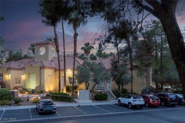 270 E Flamingo Rd Unit 131, Las Vegas, NV 89169 - property at dusk with uncovered parking