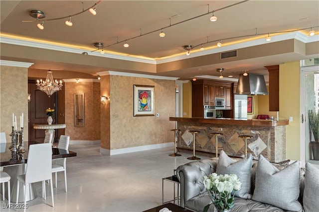 1 Hughes Center Dr Unit 308, Las Vegas, NV 89169 - living room with crown molding, finished concrete flooring, baseboards, and a chandelier