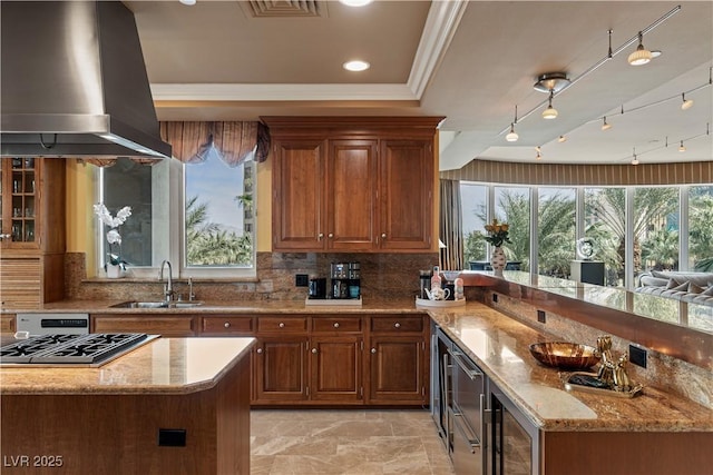 1 Hughes Center Dr Unit 308, Las Vegas, NV 89169 - kitchen featuring a sink, wall chimney range hood, beverage cooler, light stone countertops, and backsplash