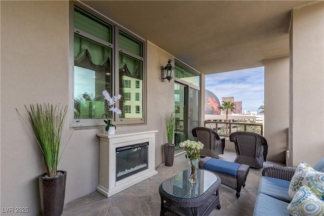1 Hughes Center Dr Unit 308, Las Vegas, NV 89169 - living room with a wall of windows and a glass covered fireplace