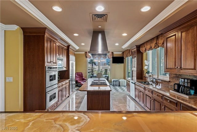1 Hughes Center Dr Unit 308, Las Vegas, NV 89169 - kitchen with a sink, a kitchen island, recessed lighting, ornamental molding, and appliances with stainless steel finishes