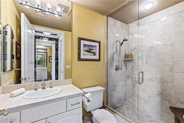 1 Hughes Center Dr Unit 308, Las Vegas, NV 89169 - bathroom with toilet, a shower stall, and vanity